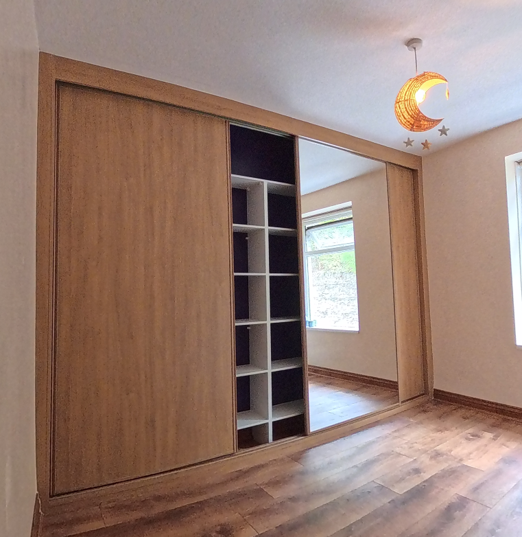 Oak-effect doors showing white interior shelving in Ystrad Mynach