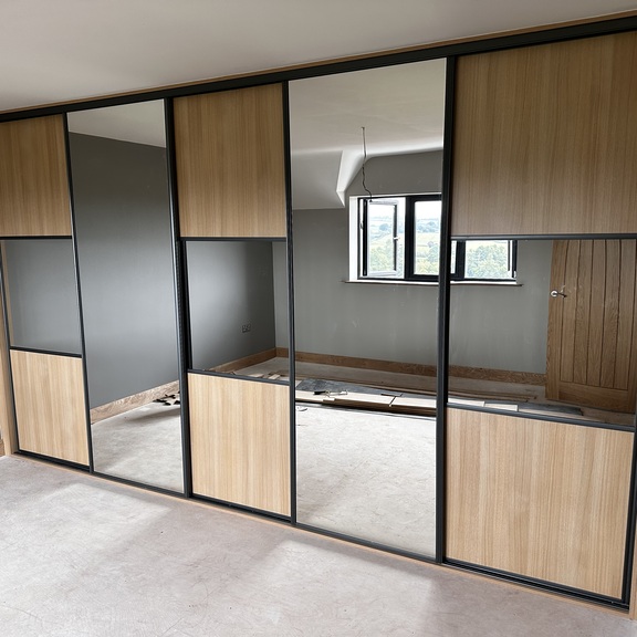 Oak panels with mirror and dark grey inserts in Cardiff