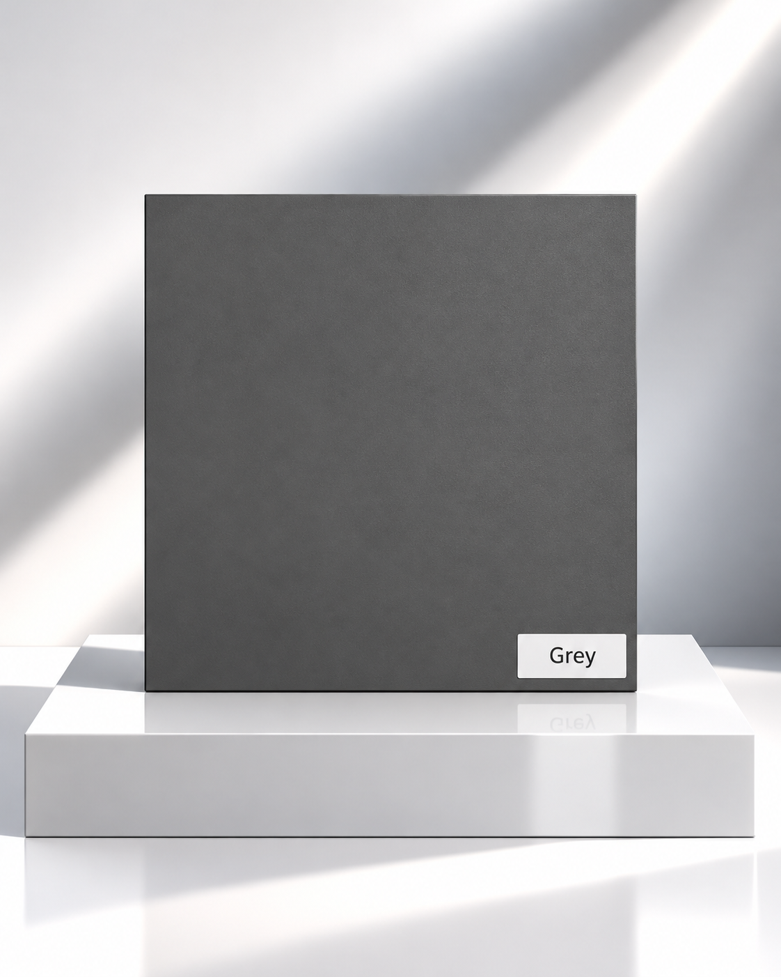 Grey solid wardrobe panel sample on a white plinth
